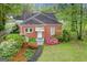 Aerial view of a brick home with a well-manicured lawn and lush greenery at 109 Stockbridge Rd, Jonesboro, GA 30236