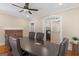 Bright conference room featuring a large table, ceiling fan, and a brick fireplace at 109 Stockbridge Rd, Jonesboro, GA 30236