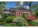 Charming brick home with mature landscaping, colorful azaleas, and inviting front entrance at 109 Stockbridge Rd, Jonesboro, GA 30236