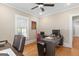 The office features hardwood floors, a ceiling fan, and abundant natural light through bright windows at 109 Stockbridge Rd, Jonesboro, GA 30236