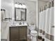 Well-maintained bathroom with decorative accents, a shower with a curtain, and a vanity at 1025 Pinehurst Dr, Peachtree City, GA 30269