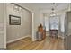 Inviting dining area featuring hardwood floors, a modern chandelier, and natural light from the adjacent bay window at 1025 Pinehurst Dr, Peachtree City, GA 30269