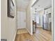 Bright foyer with hardwood floors, leading to a kitchen and dining area at 1025 Pinehurst Dr, Peachtree City, GA 30269