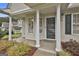 Welcoming front porch with classic columns, attractive landscaping, and inviting entrance at 1025 Pinehurst Dr, Peachtree City, GA 30269