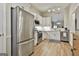 Stylish kitchen boasts stainless steel appliances, white cabinetry, and open layout at 1025 Pinehurst Dr, Peachtree City, GA 30269