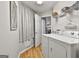 Efficient laundry area equipped with a modern washer and dryer, storage shelves, and good lighting at 1025 Pinehurst Dr, Peachtree City, GA 30269