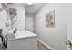 Functional laundry room with modern washer and dryer, shelving, and access to the outside at 1025 Pinehurst Dr, Peachtree City, GA 30269