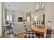 Spacious living room with an open layout, comfortable seating, and access to an outdoor patio at 1025 Pinehurst Dr, Peachtree City, GA 30269