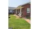 Relaxing covered porch with rocking chairs on brick home exterior at 619 E College St, Bowdon, GA 30108