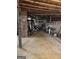 Spacious basement featuring mechanical equipment and exposed brick ready for customization at 619 E College St, Bowdon, GA 30108