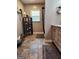 Bathroom featuring slate flooring, a vanity, and decorative shelves for storage at 619 E College St, Bowdon, GA 30108