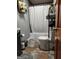 Well-maintained bathroom includes a shower-tub combo, modern toilet, vanity, and unique tile flooring at 619 E College St, Bowdon, GA 30108