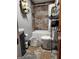 Well-maintained bathroom includes a shower-tub combo, modern toilet, vanity, and unique tile flooring at 619 E College St, Bowdon, GA 30108