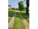 Long, paved driveway leads to a charming home on a spacious lot at 619 E College St, Bowdon, GA 30108