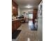 Well-lit kitchen offers plenty of cabinet space, modern appliances, and tiled flooring for easy maintenance at 619 E College St, Bowdon, GA 30108