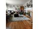 Inviting living room with hardwood floors, neutral walls, fireplace, comfortable sofas and stylish decor at 619 E College St, Bowdon, GA 30108