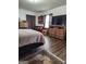 Serene main bedroom with hardwood floors and decorative accents on wooden dressers at 619 E College St, Bowdon, GA 30108