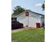 Outbuilding with stop sign and car parked out front at 619 E College St, Bowdon, GA 30108
