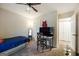 Cozy bedroom featuring soft carpet, ceiling fan, desk and chair, for a functional and comfortable space at 6403 Heritage Run, Morrow, GA 30260