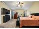 Spacious main bedroom featuring carpet, a ceiling fan, and plenty of natural light and neutral paint at 6403 Heritage Run, Morrow, GA 30260