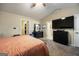 Bright main bedroom with carpet, ceiling fan, and access to an ensuite bathroom at 6403 Heritage Run, Morrow, GA 30260