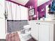 Bathroom with a white shower curtain and a single sink vanity at 329 Royal Crescent Way, Stockbridge, GA 30281