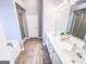 Bathroom with double vanity, tile flooring, and separate shower and tub at 329 Royal Crescent Way, Stockbridge, GA 30281
