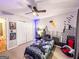 Charming bedroom with ceiling fan, closet, and themed wall decor at 329 Royal Crescent Way, Stockbridge, GA 30281