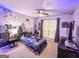 The bedroom features themed decor, a ceiling fan, and a window at 329 Royal Crescent Way, Stockbridge, GA 30281