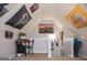 Attic bonus room featuring flags, string lights, desk and workspace, and carpet flooring at 329 Royal Crescent Way, Stockbridge, GA 30281