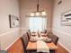 Elegant dining room featuring hardwood floors and an inviting table setting for a warm, welcoming atmosphere at 329 Royal Crescent Way, Stockbridge, GA 30281