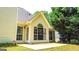 Back of home featuring large arched windows, siding exterior, concrete patio, and grill at 329 Royal Crescent Way, Stockbridge, GA 30281