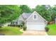 Charming home with well-maintained landscaping, and a two-car garage at 329 Royal Crescent Way, Stockbridge, GA 30281