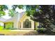 Back exterior view of home, featuring a spacious patio and large window at 329 Royal Crescent Way, Stockbridge, GA 30281