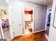 Hallway view with an open door to a bathroom and bedroom at 329 Royal Crescent Way, Stockbridge, GA 30281
