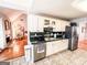 Spacious kitchen with white cabinets, green tile countertops, stainless steel appliances, and tiled floor at 329 Royal Crescent Way, Stockbridge, GA 30281