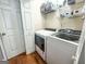 Functional laundry room equipped with modern washer and dryer, and wire shelving for convenient storage at 329 Royal Crescent Way, Stockbridge, GA 30281