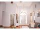 Welcoming living room featuring soaring ceilings, hardwood floors, front door view and lots of natural light at 329 Royal Crescent Way, Stockbridge, GA 30281