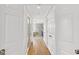 Hallway leading to bathroom with walk-in shower and double closets at 513 Viridian Vw, Peachtree City, GA 30269