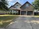 Charming two-story home with a well-maintained lawn and a spacious two-car garage at 860 Nevis Way, Mcdonough, GA 30253