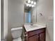 Bathroom featuring a clean white sink, mirror, vanity, and toilet, providing a functional space at 471 Lanier Ct, Hiram, GA 30141