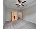 Large bedroom showcasing a tray ceiling, plush carpeting, and multiple doorways at 471 Lanier Ct, Hiram, GA 30141