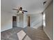 Spacious bedroom featuring neutral walls, a ceiling fan, and plush carpeting for added comfort at 471 Lanier Ct, Hiram, GA 30141