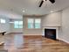 Cozy living room with a fireplace, wood flooring, natural lighting, and ample space for entertaining at 471 Lanier Ct, Hiram, GA 30141