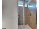Beautifully tiled standing shower with glass door and chrome fixtures at 471 Lanier Ct, Hiram, GA 30141