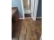 Bathroom with wood-look tile floors and a vanity adjacent to a bathroom with a bathtub at 366 Montgomery Pl, Jonesboro, GA 30238