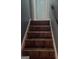 Staircase with carpeted steps leading to a white door upstairs at 366 Montgomery Pl, Jonesboro, GA 30238