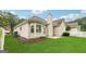 Well-maintained backyard featuring lush grass, mature trees, and a privacy fence at 412 Rock Creek Dr, Peachtree City, GA 30269