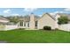 Well-maintained backyard featuring lush grass, mature trees, and manicured shrubbery at 412 Rock Creek Dr, Peachtree City, GA 30269