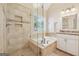Bright bathroom featuring a walk-in shower, soaking tub, and granite countertop vanity at 412 Rock Creek Dr, Peachtree City, GA 30269